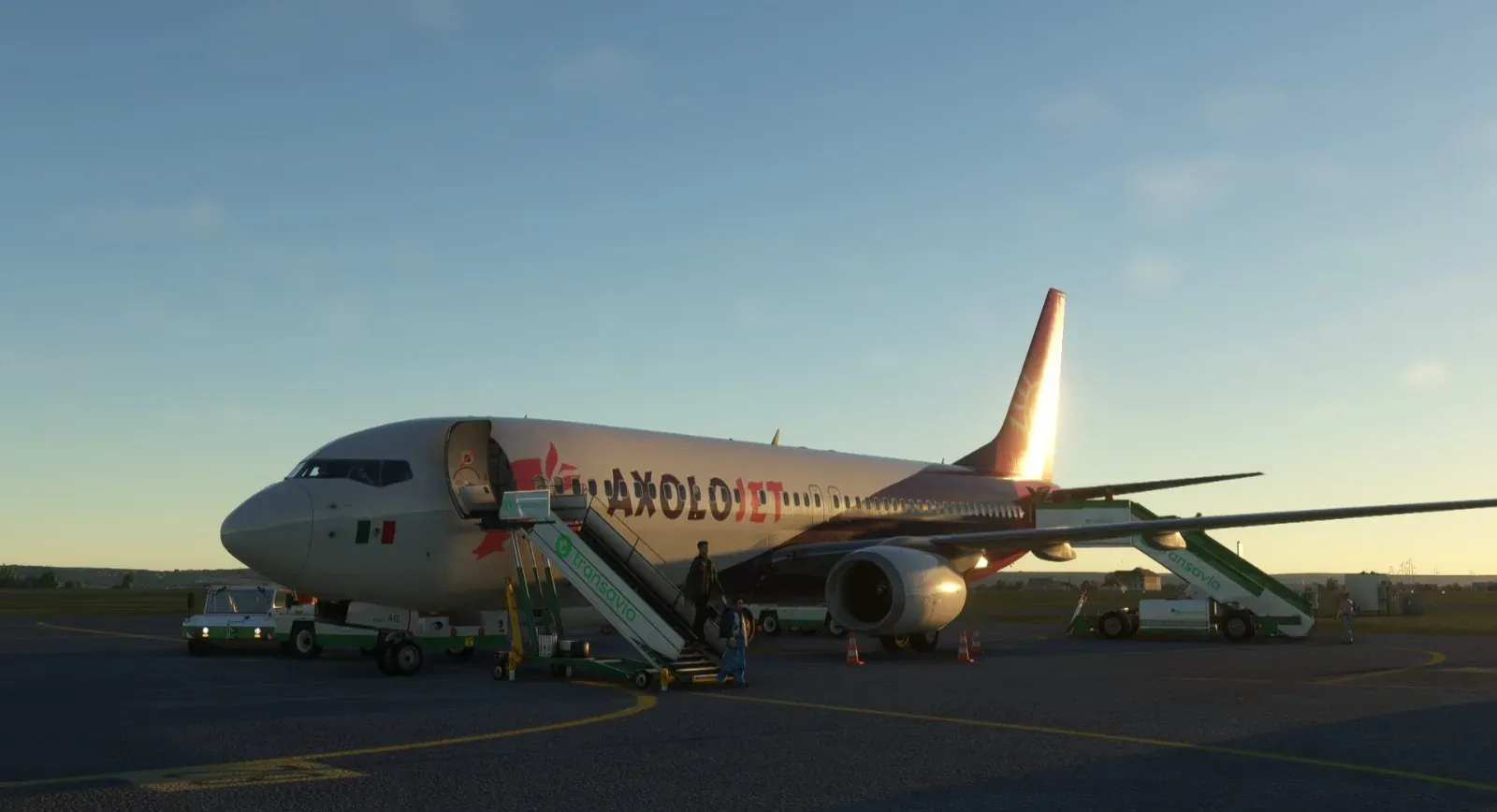 Axolojet Boeing 737 boarding by the airstairs at sunset