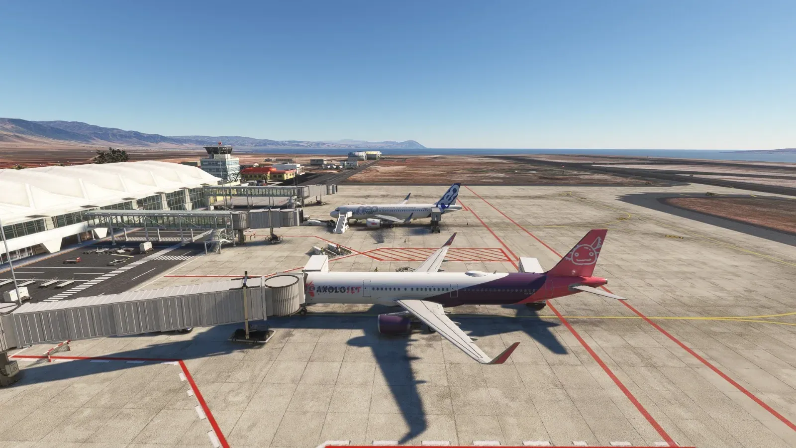 Axolojet Airbus A321 at a terminal between desert and sea